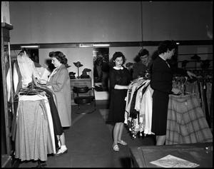 Primary view of object titled '[Women in clothing store, 1943]'.