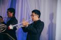 Photograph: [Two musicians playing trumpets at the reception for the UNT College …
