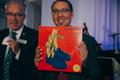 Primary view of [John W. Richmond speaking and Alan Baylock holding One O'Clock Lab Band: Lab 2017 vinyl record at reception for the UNT College of Music Gala]