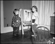 Thumbnail image of item number 1 in: '[Children at Art Easel 1942]'.
