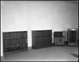 Thumbnail image of item number 1 in: '[Record Player and Two Bookcases Inside an Unidentified Building]'.