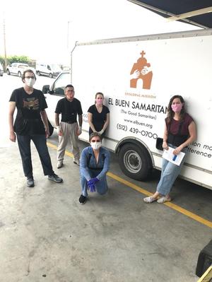 Primary view of object titled '[El Buen Samaritano food pantry volunteers and truck]'.