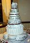 Primary view of [White tiered cake with black and brown detailing]