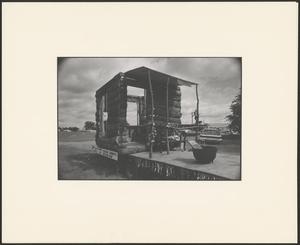 Primary view of object titled '[The wooden shack of "Payless Lumber Co."]'.