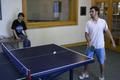 Photograph: [Shawn Nikah plays ping-pong with TAMS student]