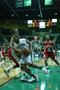 Photograph: [WKU player performs defense on UNT women's basketball player during …