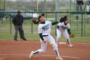 Primary view of object titled '[North Texas softball player pitches during a game, 5]'.