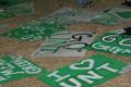 Photograph: [UNT football signs scattered on grass]