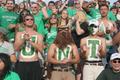 Thumbnail image of item number 1 in: '[Men wear UNT body paint at a football game]'.