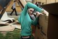 Photograph: [Student builds cardboard home at Shack-a-thon fundraising event]