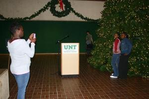 Primary view of object titled '[Students pose for photograph at UNT Tree Lighting Ceremony]'.
