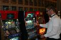 Photograph: [Man works slot machine at UNT Casino Night]