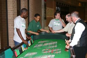 Primary view of object titled '[Students play tabletop game during UNT Casino Night]'.