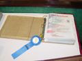 Photograph: [2003 TXSSAR Plano chapter yearbook with 1st place ribbon]