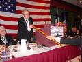 Photograph: [Man hands stick to Dick Robinett at the TXSSAR 109th Annual State Co…