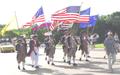 Photograph: [TXSSAR Color Guard marches during outdoor event, 3]