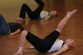 Photograph: [Photograph of a woman stretching at UPC dance class]