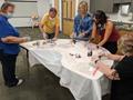 Thumbnail image of item number 1 in: '[Manatee County Public Library System: Palmetto Branch Library staff painting face masks]'.