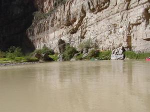 Primary view of object titled '[People canoe in Big Bend canyon mouth, 2]'.