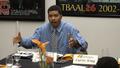 Photograph: [Omar Tyree at Turning the Tables breakfast, sitting]