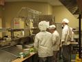 Photograph: [SMHM students prepare food at The Club, 4]