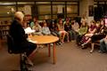 Photograph: [Gretchen Bataille reads "Hoot" book to Crownover students, 3]
