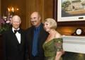 Photograph: [Dr. Phil with Gretchen Bataille and man at inauguration reception]