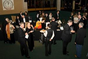 Primary view of object titled '[Attendees at 2008 Emerald Ball auction tables, overhead view]'.