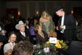 Photograph: [Gretchen Bataille with guests at table 19, 2008 Emerald Ball, 1]