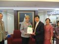 Thumbnail image of item number 1 in: '[Man 2 receives gift from Gretchen Bataille at Thailand delegation meeting]'.
