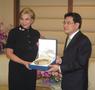 Photograph: [Gretchen Bataille receives gift at Thailand delegation meeting]