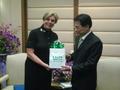Thumbnail image of item number 1 in: '[Man 4 receives gift from Gretchen Bataille at Thailand delegation meeting]'.