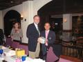 Photograph: [Earl Gibbons receives gift at delegation dinner]