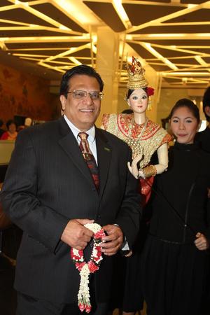 Primary view of object titled '[Vish Prasad poses with Thai puppet, 3]'.