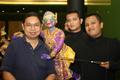 Photograph: [Pijarn Charoensri poses with Thai puppet]