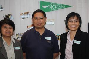Primary view of object titled '[Patamaporn Sukplang, Pijarn Charoensri, and Acharawan Thongmee at UNT alumni party in Bangkok]'.
