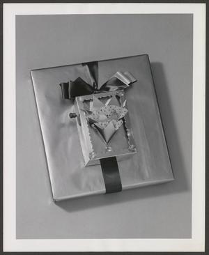 Primary view of object titled '[Product photograph of a wrapped Christmas gift box embellished with a paper arts tree and shadow box]'.
