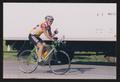 Primary view of [Cyclist Ray Allen passing a U.S mail truck: Lone Star Ride 2002 event photo]