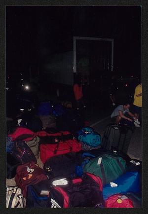 Primary view of object titled '[Gear in duffel bags lined up for loading: Lone Star Ride 2002 event photo]'.