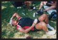 Photograph: [Cyclist icing his forehead: Lone Star Ride 2002 event photo]