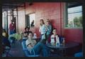 Photograph: [Multiple people seated at tables on a patio: Lone Star Ride 2003 eve…