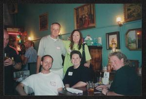 Primary view of object titled '[5 people gathered around a small bar table: Lone Star Ride 2003 event photo]'.