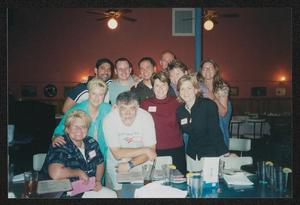 Primary view of object titled '[11 people standing behind a table: Lone Star Ride 2003 event photo]'.