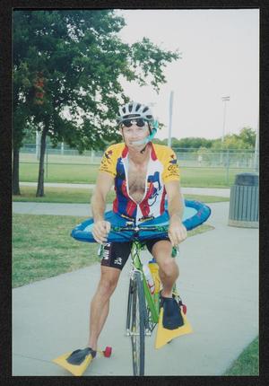 Primary view of object titled '[Cyclist wearing snorkeling gear: Lone Star Ride 2003 event photo]'.