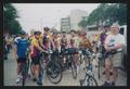 Primary view of [Group of cyclists posing in a parade: Lone Star Ride 2003 event photo]