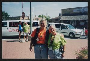 Primary view of object titled '[Janie Bush and other crew women in orange: Lone Star Ride 2003 event photo]'.