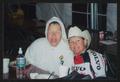 Thumbnail image of item number 1 in: '[Two individuals seated at long banquet table eating breakfast: Lone Star Ride 2003 event photo]'.