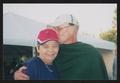 Primary view of [Older couple embracing and kissing: Lone Star Ride 2003 event photo]
