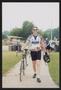 Thumbnail image of item number 1 in: '[Cyclists walking with their bikes: Lone Star Ride 2004 event photo]'.