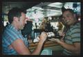 Thumbnail image of item number 1 in: '[Two men sharing an ice cream desert]'.